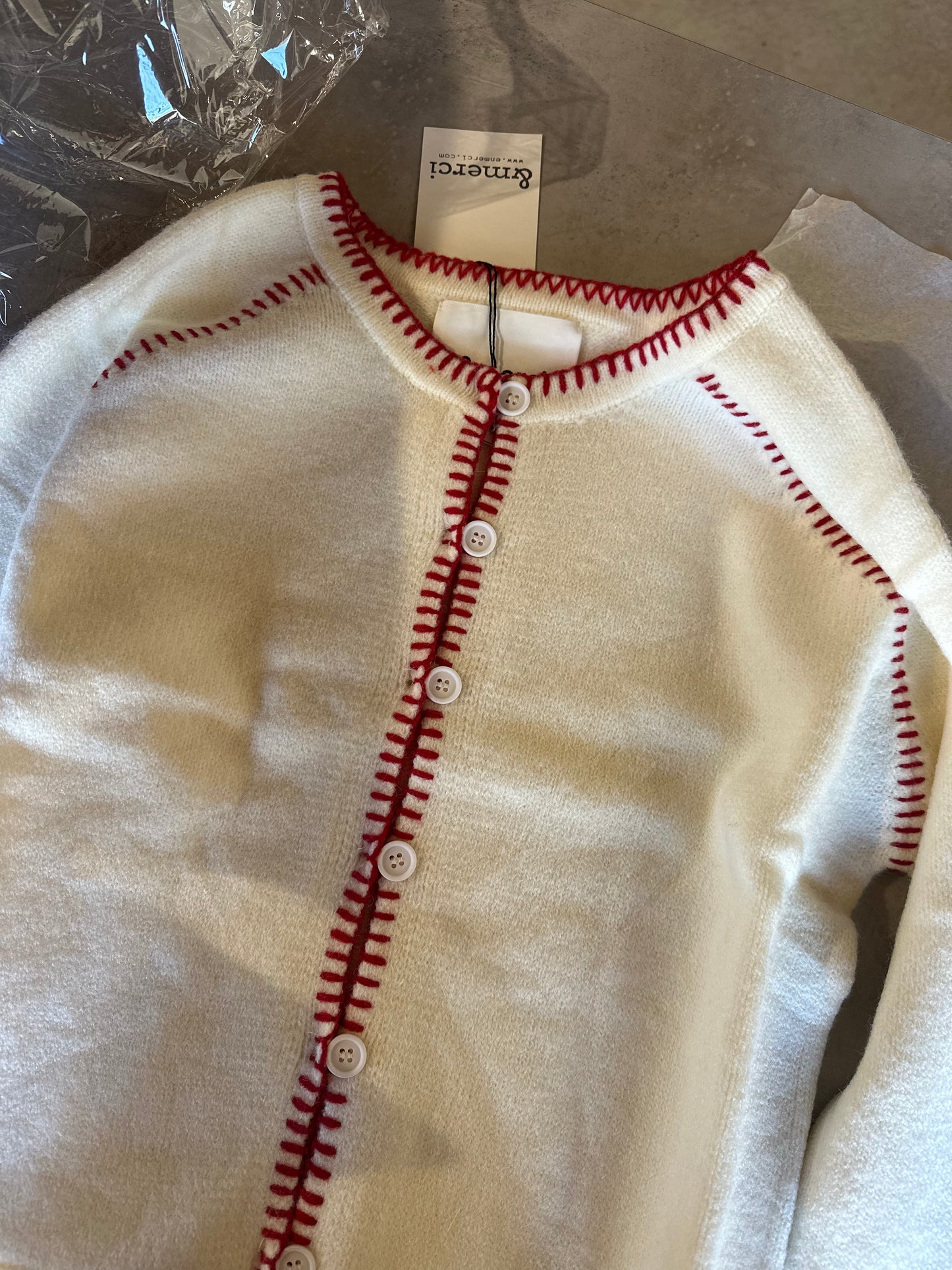 red stitched sweater